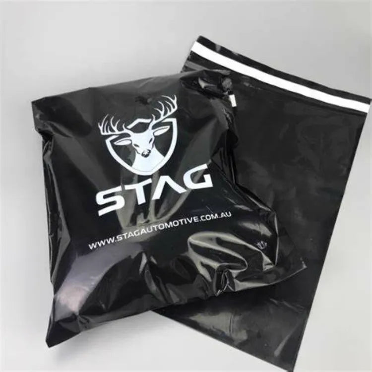 Black plastic shipping bag with white STAG lettering and a line-drawn animal logo