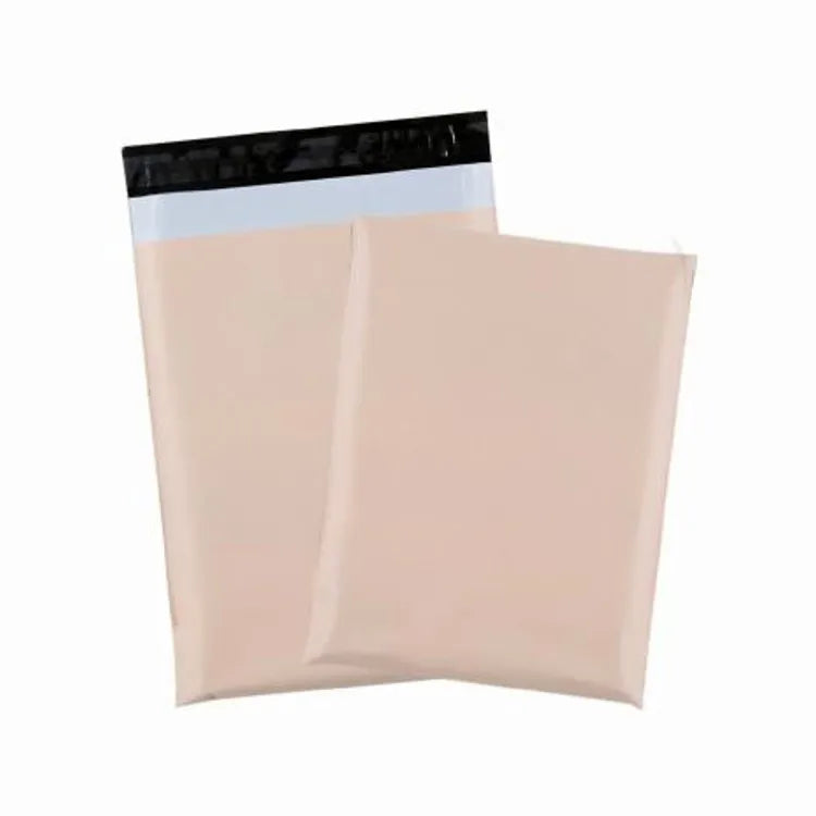 Two peach-colored plastic mailer bags showing a black closure strip