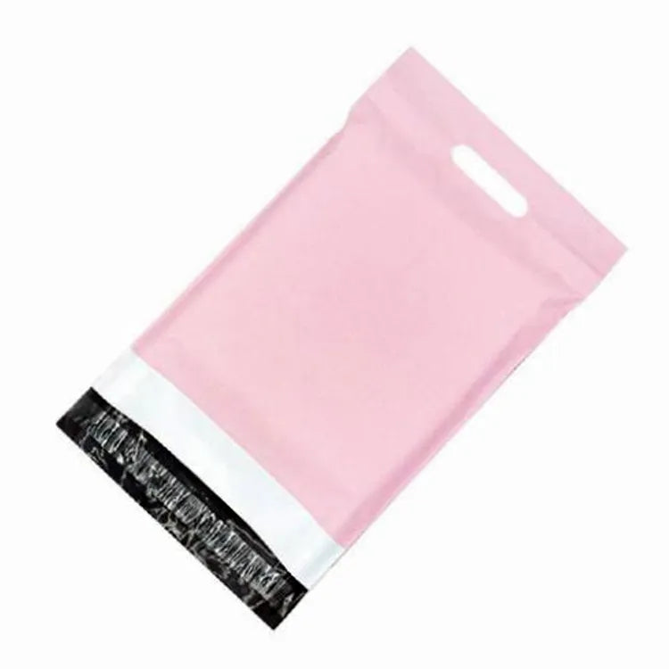 Pink plastic mailer bag with a die-cut handle and an open black adhesive closure flap