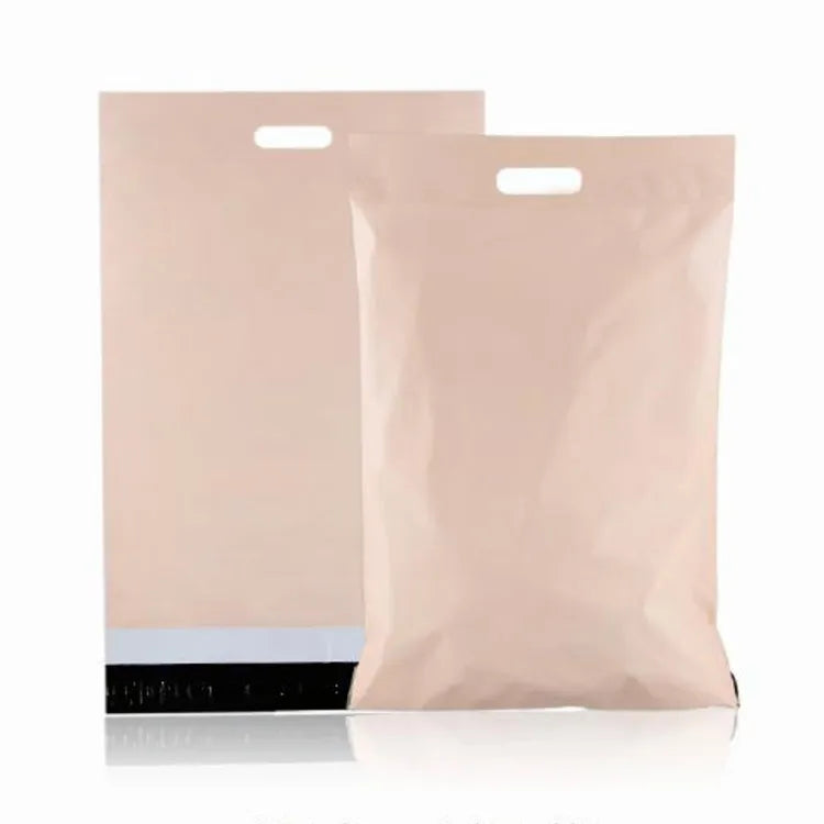 Two peach-colored plastic mailer bags with die-cut handles, showing the front and adhesive closure flap