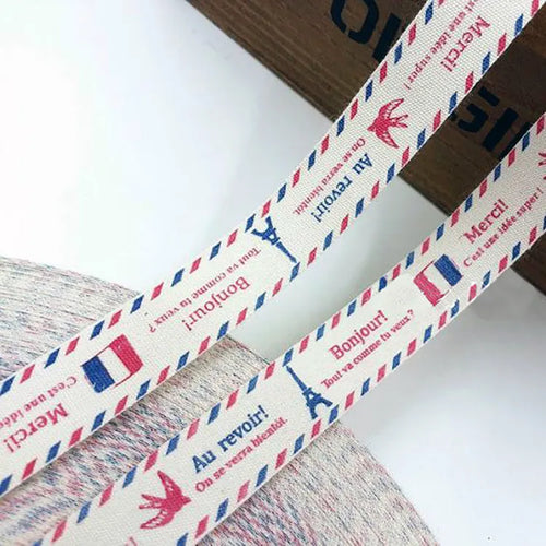 Vintage airmail inspired printed cotton tape featuring Eiffel tower icons and bilingual typography
