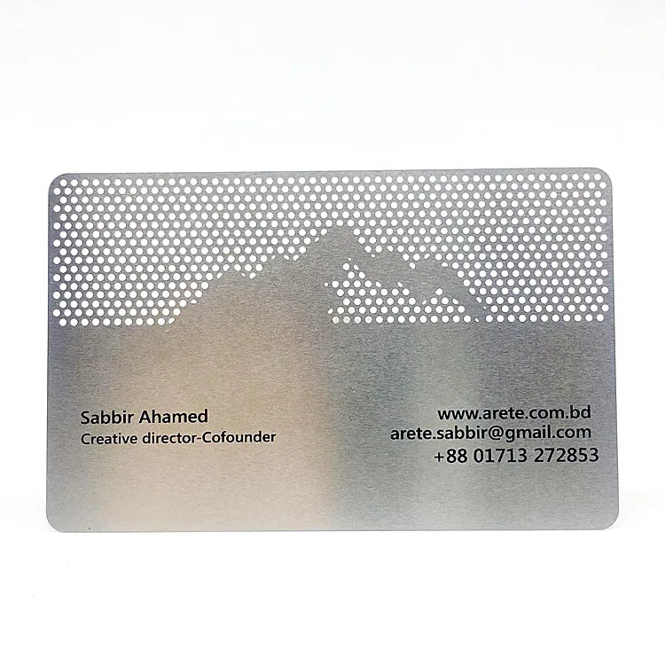 Silver-tone metal business card with a house-shaped dotted pattern