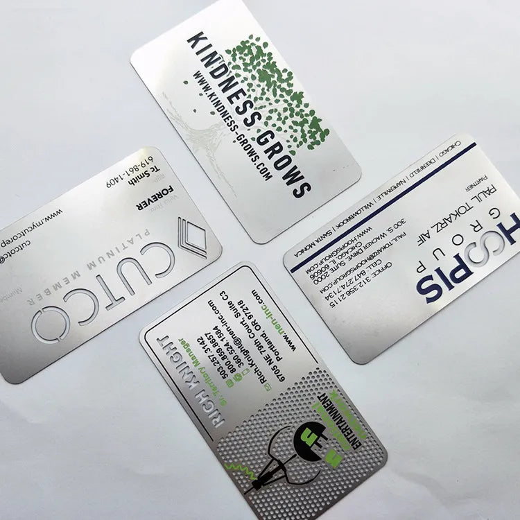 Silver-tone metal business cards with a wide black stripe and printed contact details