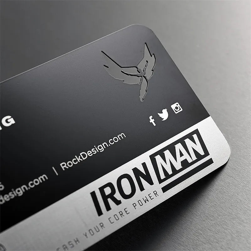 Dark metal business card with IRON MAN lettering and a stylized logo