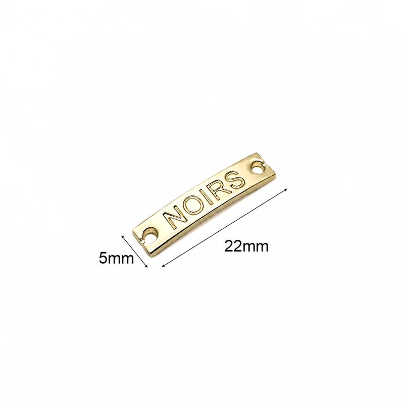 Custom rose gold script sew on metal tag with dual stitch holes for apparel and accessories