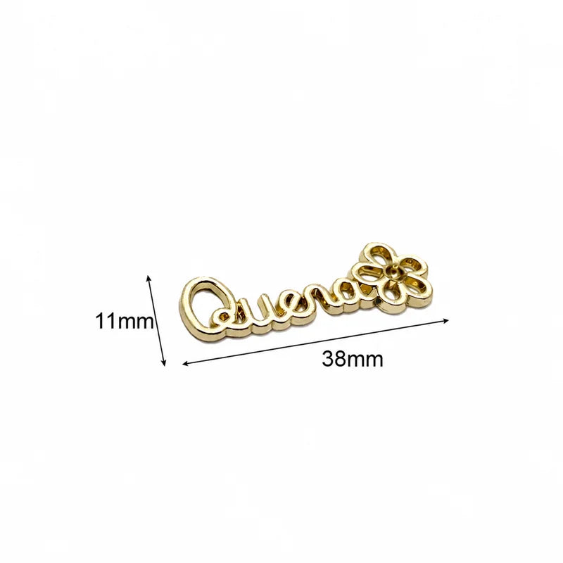 Gold engraved metal clothing tag plaque showing 5mm by 22mm dimension specifications