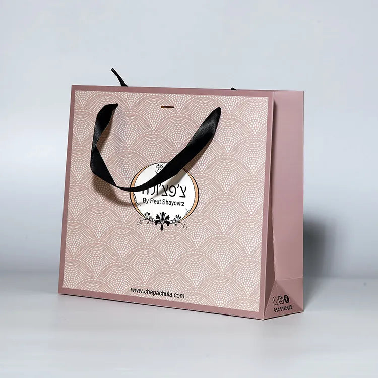 Taupe paper shopping bag with black cord handles and a decorative printed logo