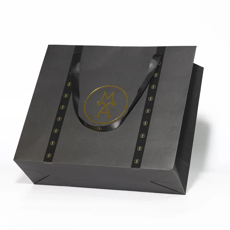 Gray paper shopping bag with matching ribbon handles and dark decorative side strips