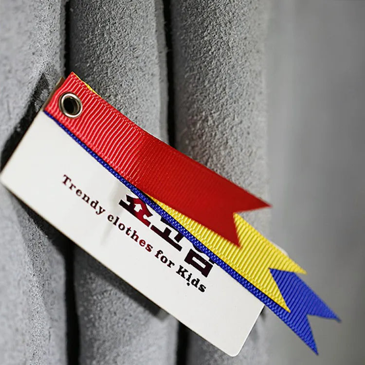 Custom die-cut hang tag with red, yellow and blue lightning-shaped edges