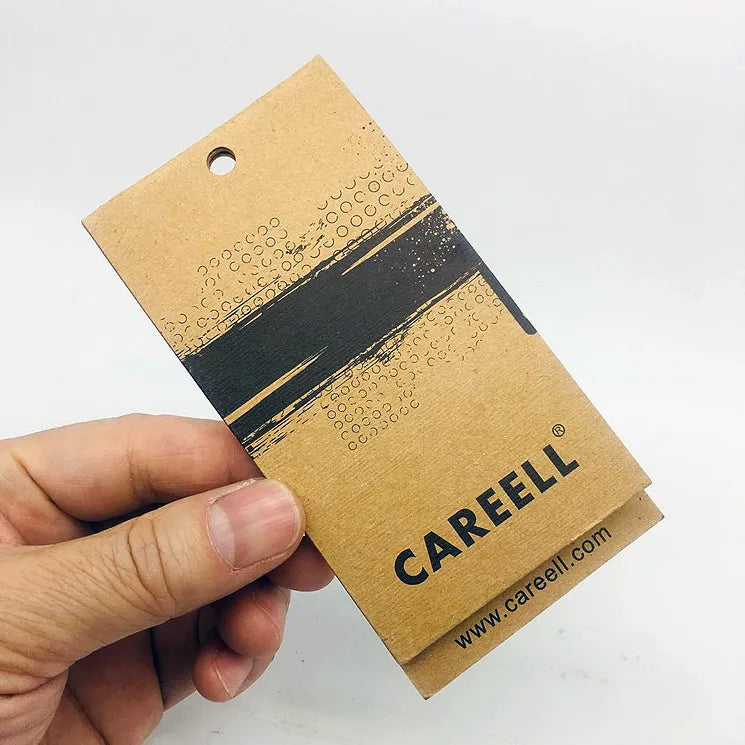 Brown paper clothing tag with black printed band and small lettering