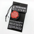 Custom Luxury Wax Seal Hang Tag – Matte Black Card with Applied Wax Emblem