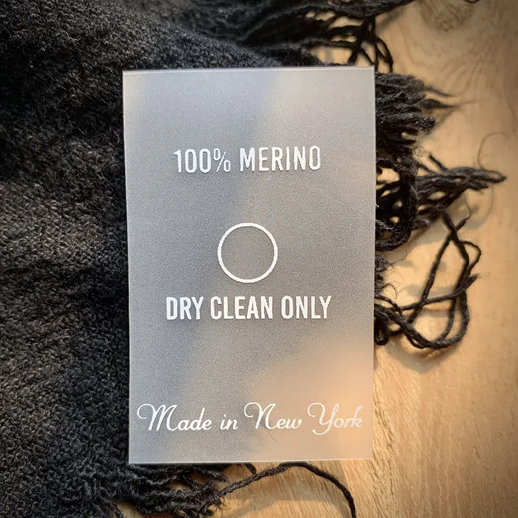 Frosted translucent rectangular garment hang tag with white printed lettering