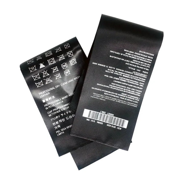 Black care labels with white text, care symbols and barcode details