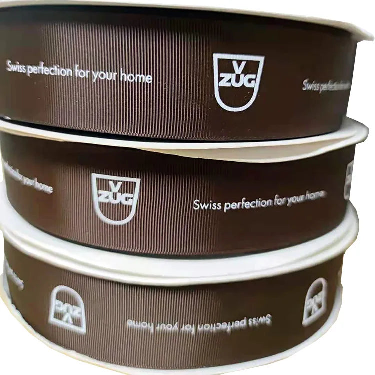 Trio stack of custom printed logo ribbon rolls for retail merchandise and apparel packaging