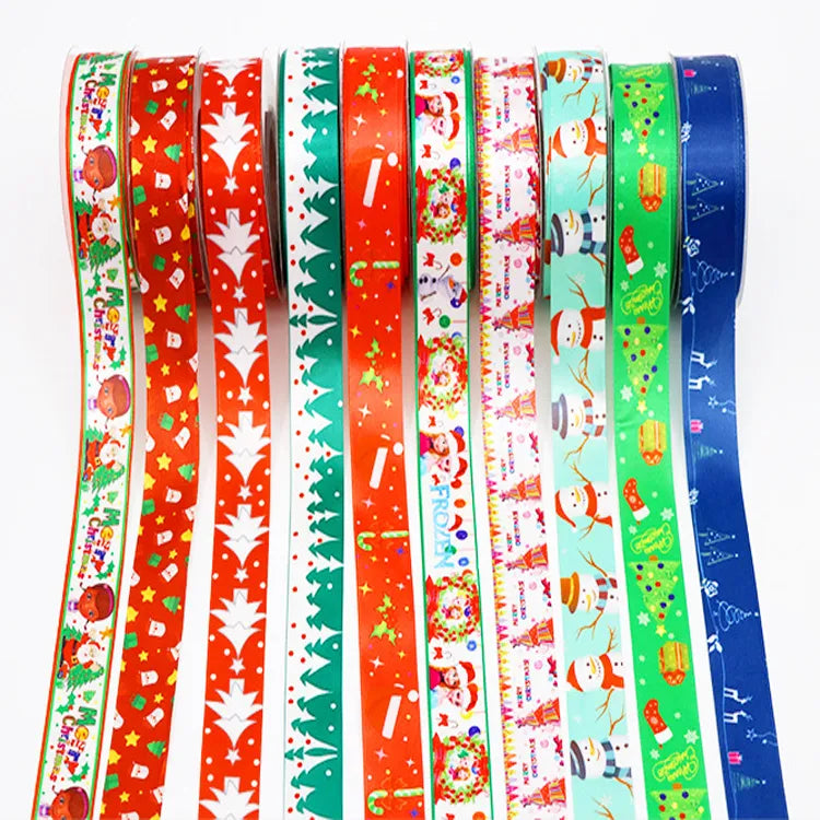 Assorted colorful Christmas holiday printed ribbons unrolled for holiday packaging displays