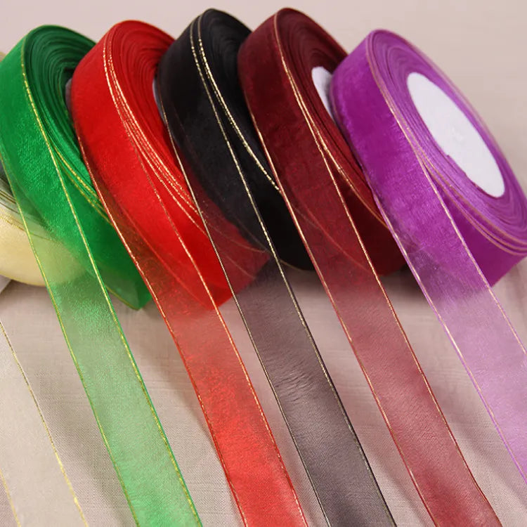 Metallic border sheer ribbon spools in jewel tones for gift wrapping and floral arrangements