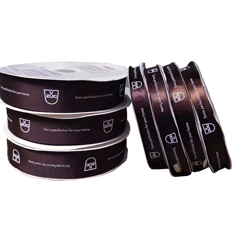 Custom logo printed satin ribbon spools in dark brown and black for corporate packaging