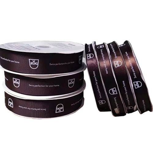 Custom logo printed satin ribbon spools in dark brown and black for corporate packaging