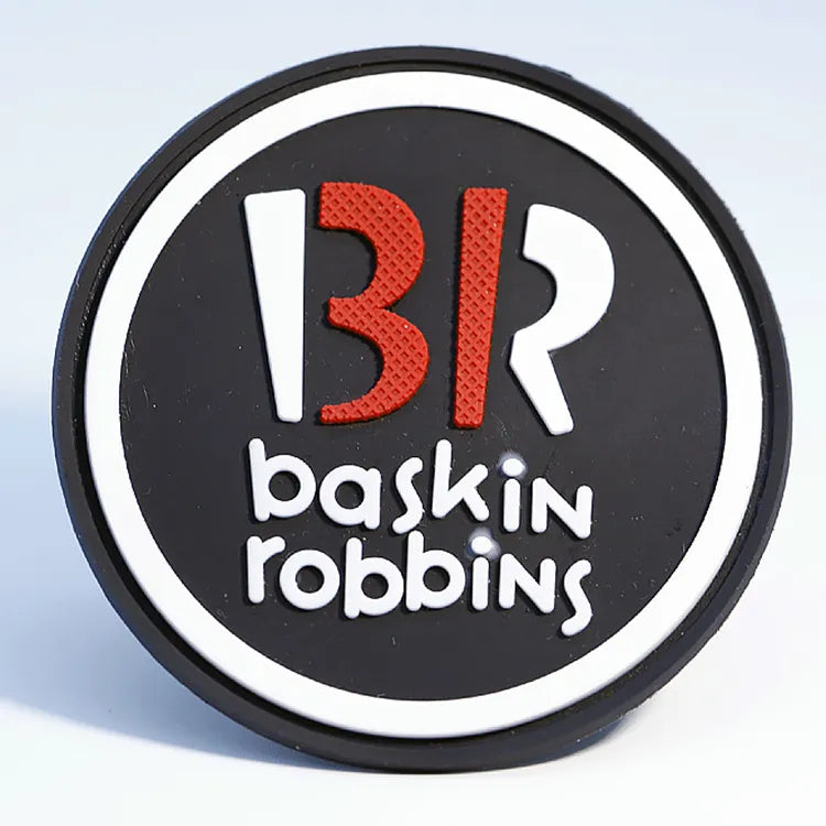 Multi-color drip-molded round rubber logo patch with vibrant PMS colors