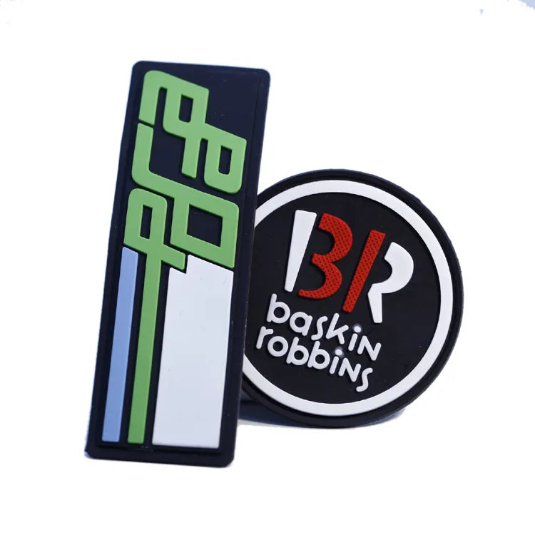 Custom PVC rubber patches featuring a geometric design and Baskin-Robbins logo