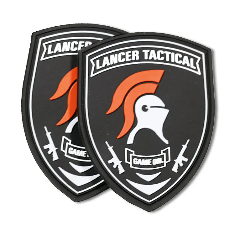 Custom black and orange shield-shaped PVC tactical patches with a Spartan helmet, crossed rifles and raised lettering