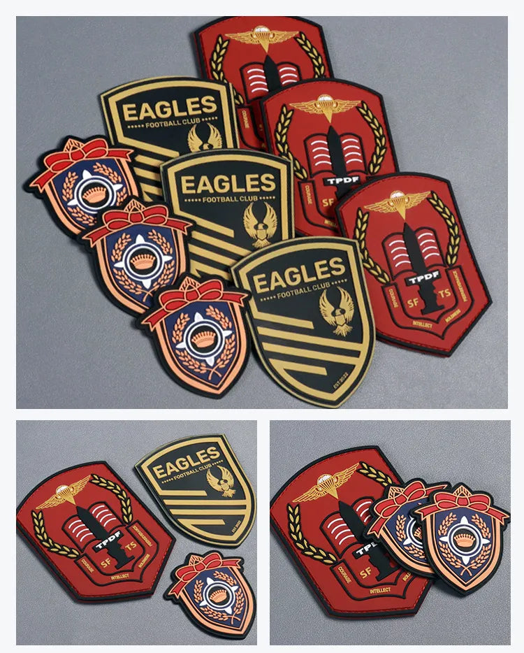 Assorted red and orange shield-shaped rubber brand badges