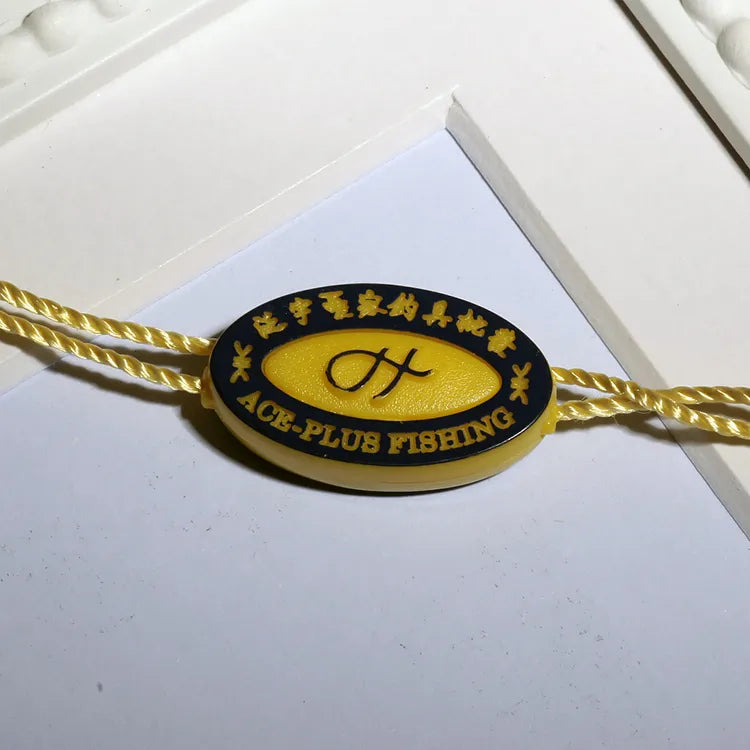 Yellow oval plastic seal tag with yellow twisted cords