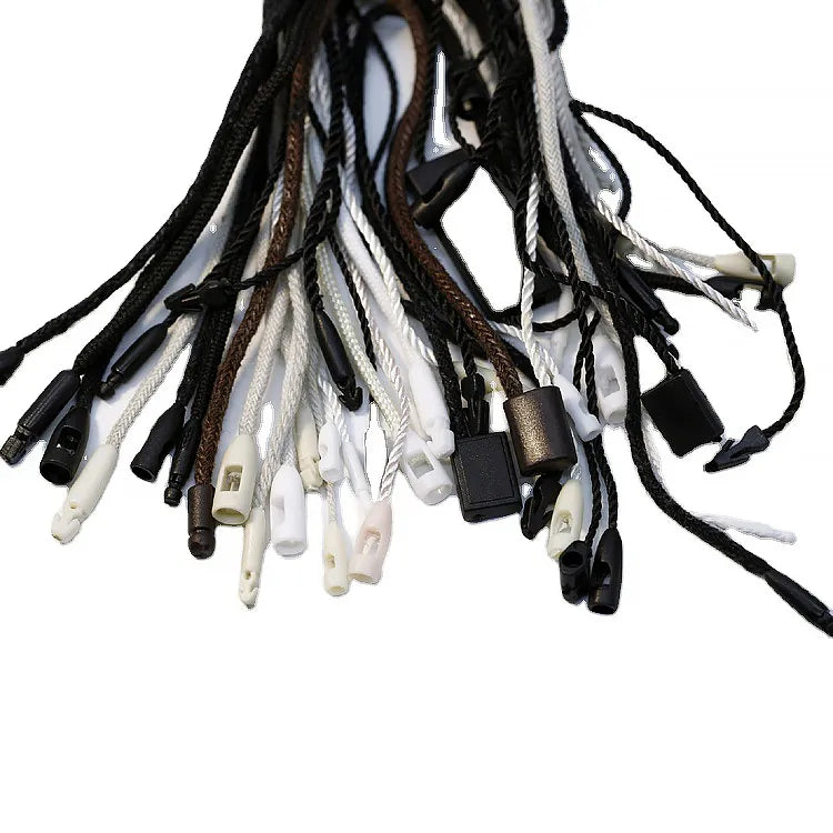 Bundle of assorted hang tag strings with plastic barb ends and barrel locks