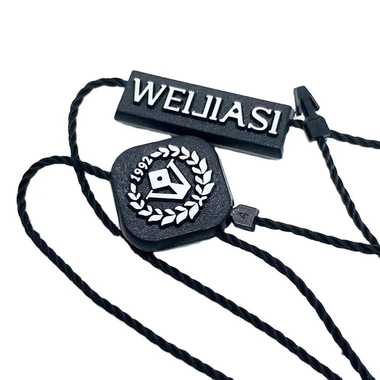 Black rectangular and square plastic string tags with black twisted cords and plastic barb fasteners