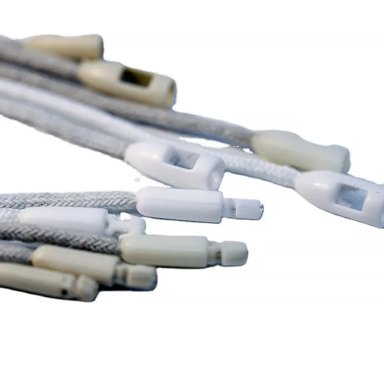 Grey braided cords closeup with white plastic cylindrical lock ends