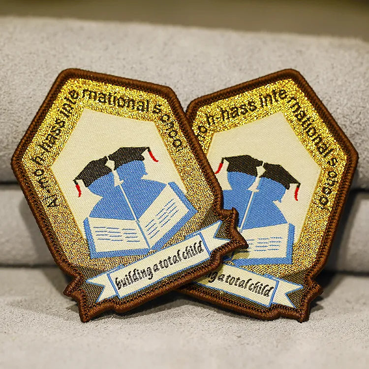 Gold-bordered shield school badges with blue and white central crests