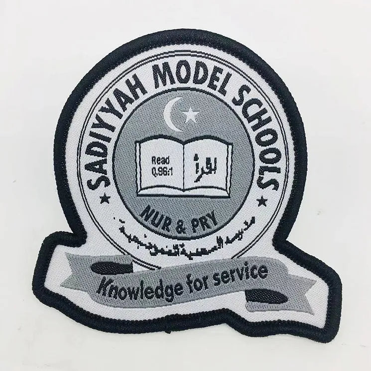 Custom embroidered Sadiyyah Model School badge patch with an open book, crescent and star, Arabic lettering, and “Knowledge for service” banner