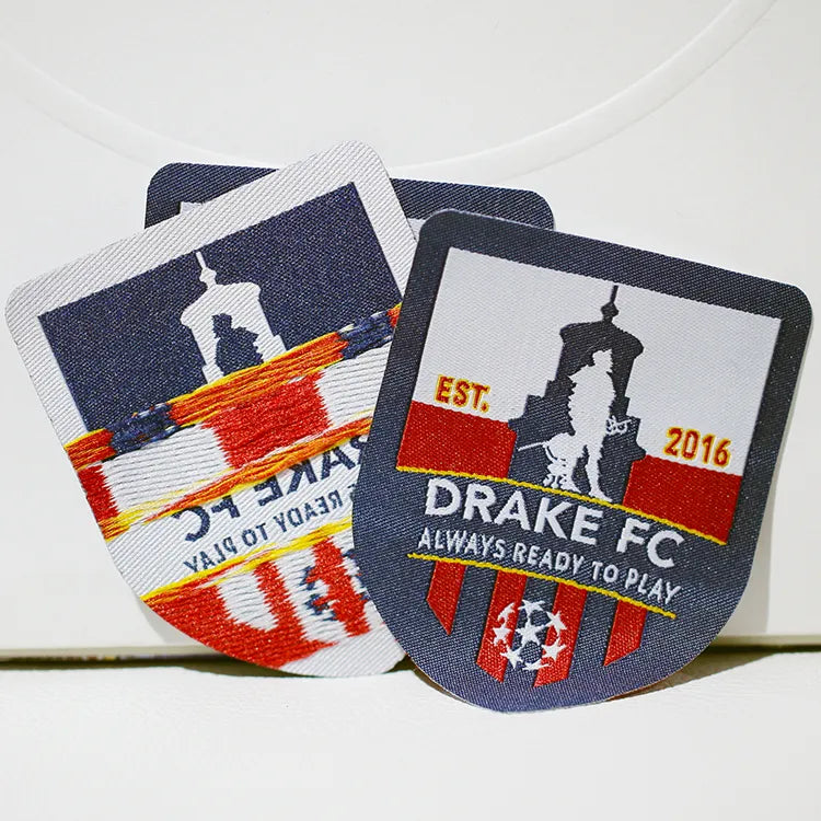 Two embroidered football-themed patches with player silhouettes
