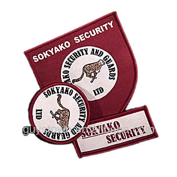 Custom maroon embroidered security company patches with shield and circular badge designs