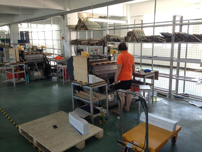 Factory production area with equipment and work tables