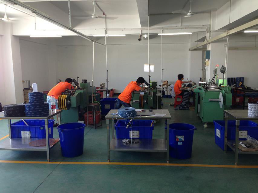 Production workshop with staff and material containers