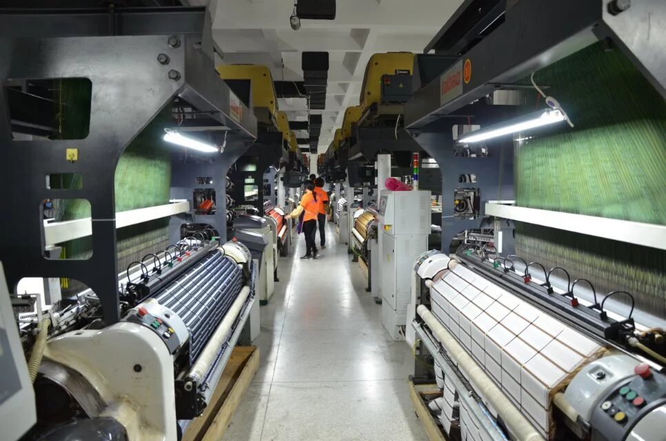 Rows of weaving equipment in the factory
