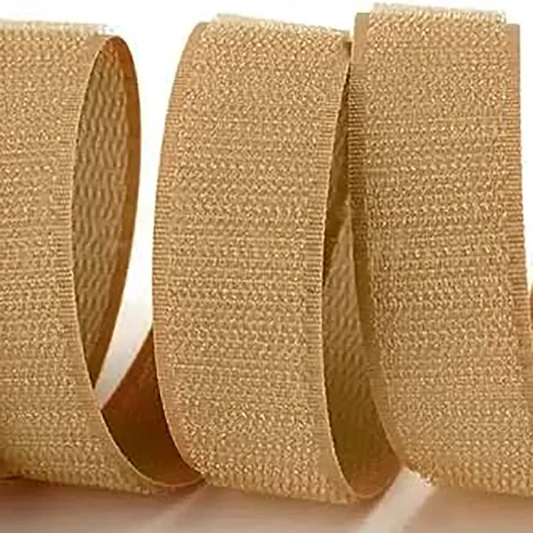 Beige hook and loop strips curved into loops