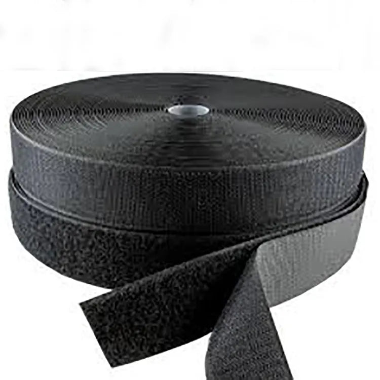 Two dark hook and loop rolls and loose hook and loop ends