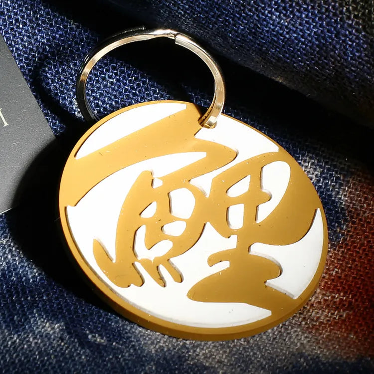 Custom round gold and white embossed silicone rubber keychain pendant with metal key ring