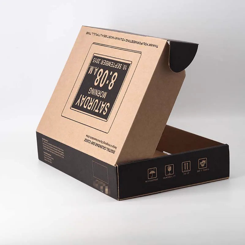 Open kraft mailer box with black side panels, printed lid artwork and handling symbols