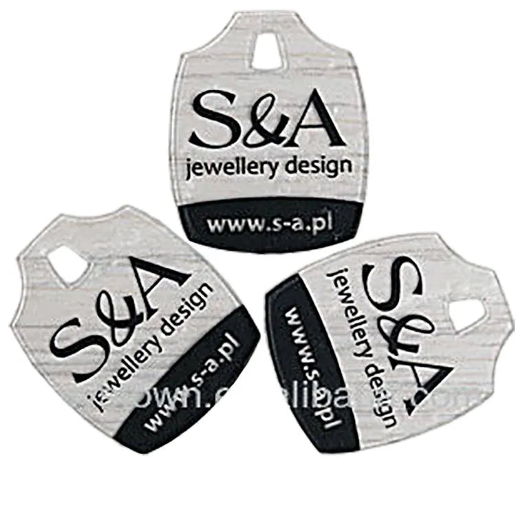 Three clear plastic brand tags showing die-cut hanging slots and screen-printed graphics