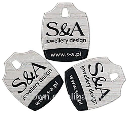 Three clear plastic brand tags showing die-cut hanging slots and screen-printed graphics