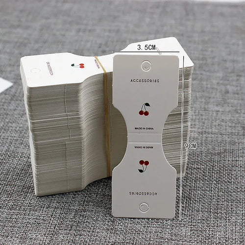 Foldover cards with dimensions showing round hang hole and cherry illustration