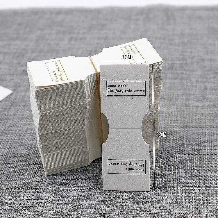 Narrow foldover cards stack showing precise die-cut edge finish