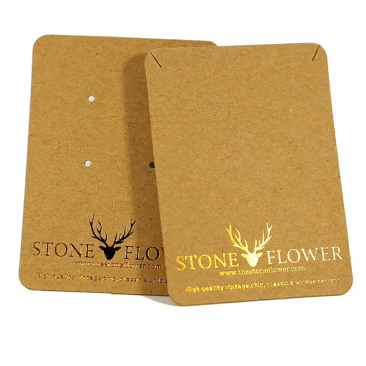 Kraft paper jewelry display cards with gold foil branding and pre-punched holes for multi-piece jewelry