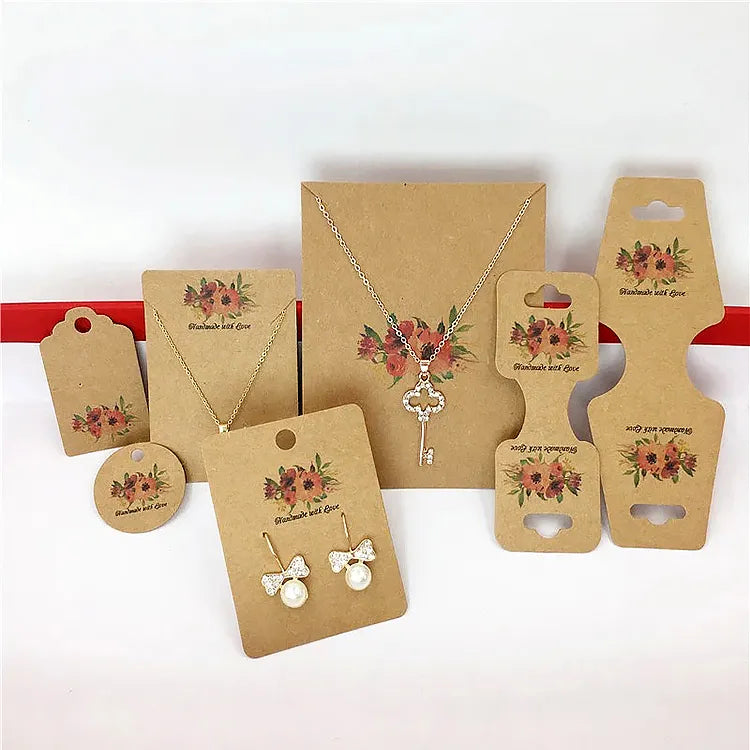 Kraft jewelry display card suite featuring floral prints for necklaces, earrings, and tags